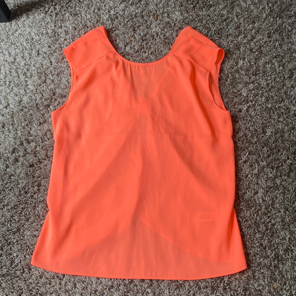 bright neon orange express top. open/ bow on back